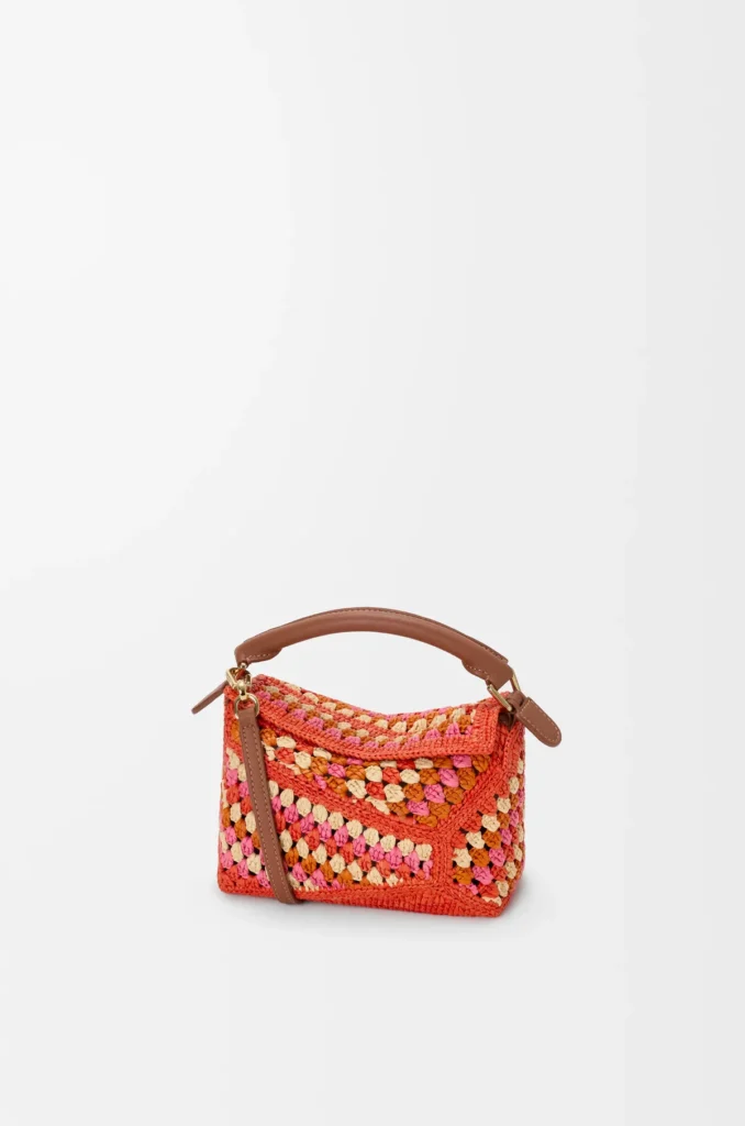 Authentic Loewe Puzzle bags for women — the house's signature geometric calf leather carry with top handle, shoulder strap, and crossbody options in sizes from mini to large, verified originals at The Authentic Bags